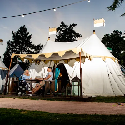 Parents outside tent