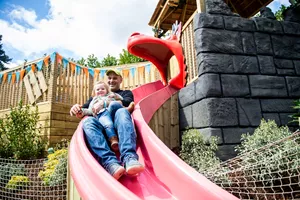 Dad and child on slide
