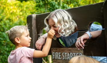 Mother and boy in stocks