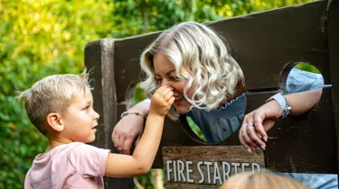 Mother and boy in stocks