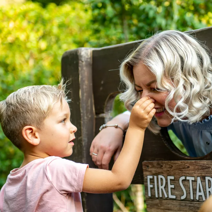 Mother and boy in stocks